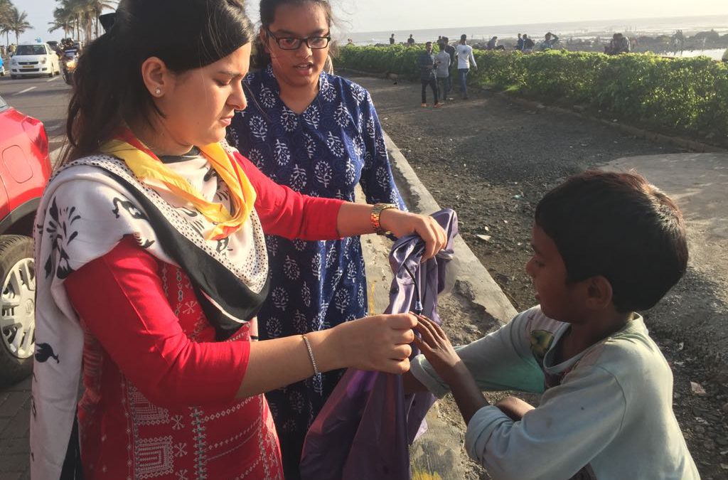Distribution of raincoats & umbrellas at Mumbai